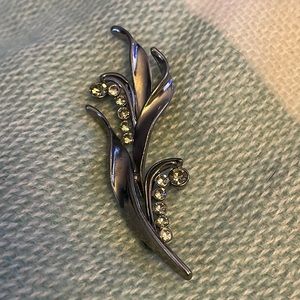 Gun metal and rhinestone brooch